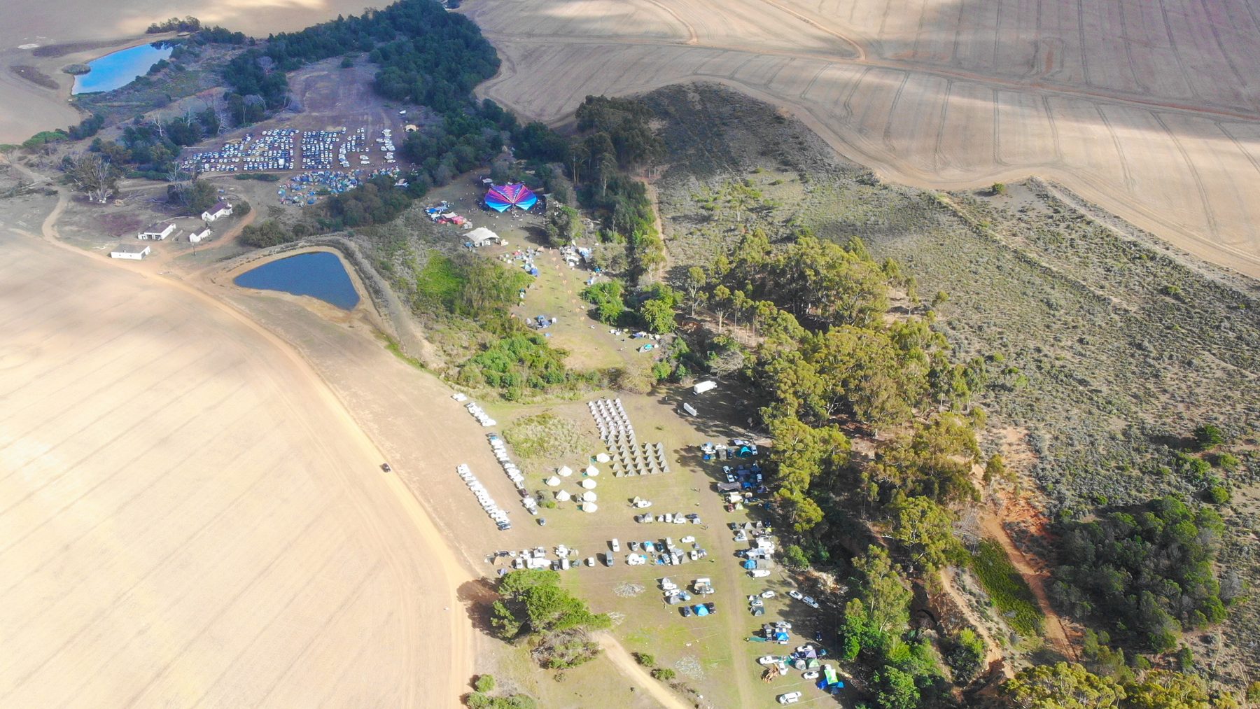 Aerial view of the festival site at Dieprivier Farm, showing the dance floor, dams, parking and camping areas